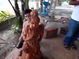 Cambodian wood carver carving Teak Chinese sculpture
