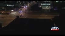 Shots ring out between suspect and Dallas police in front of police headquarters