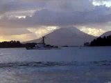 Surfing and bodyboarding at sandy beach on Alaska Day