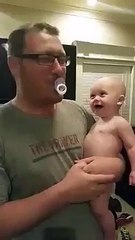 Mom and dad with their Laughing Baby
