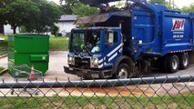 Blue Garbage Truck Dumping Blue Dumpster