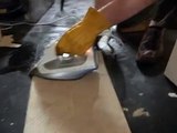 Removing Vinyl Floor Tiles with an Electric Steam Iron.