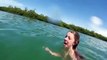 Woman cries while swimming next to giant manatee