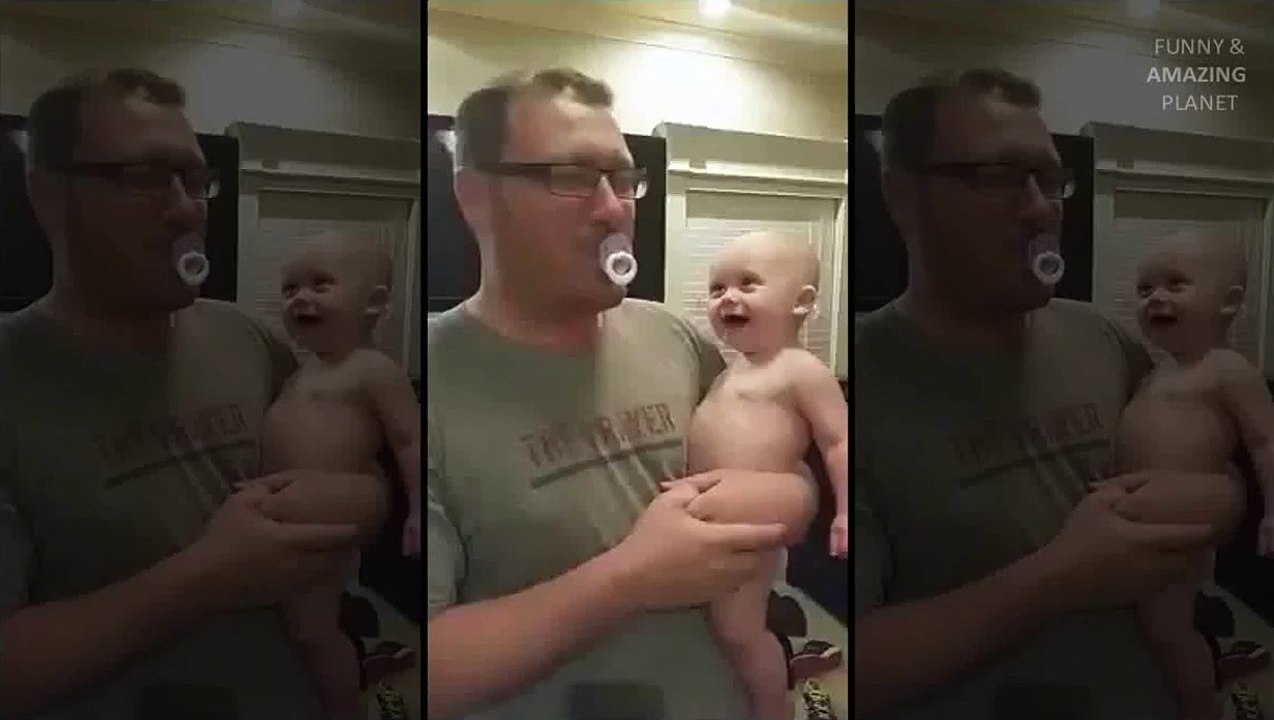 Baby can't stop laughing when dad spits out pacifier