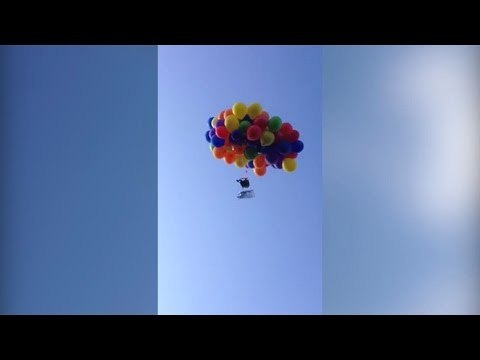 Daredevil Canadian man flies on a plastic chair tied with 100 helium balloons, arrested