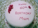 Pretty 60th Birthday Cake decorated with pink sugarpaste flowers