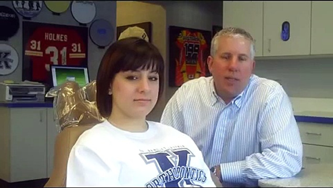 Orthodontist Places Braces on Patient--See how easy it is to get braces.