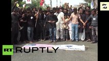 Les drapeaux américain et israélien brûlés lors d'une manifestation pro-palestinienne à Karachi