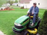 John Deer and Dad mowing the grass