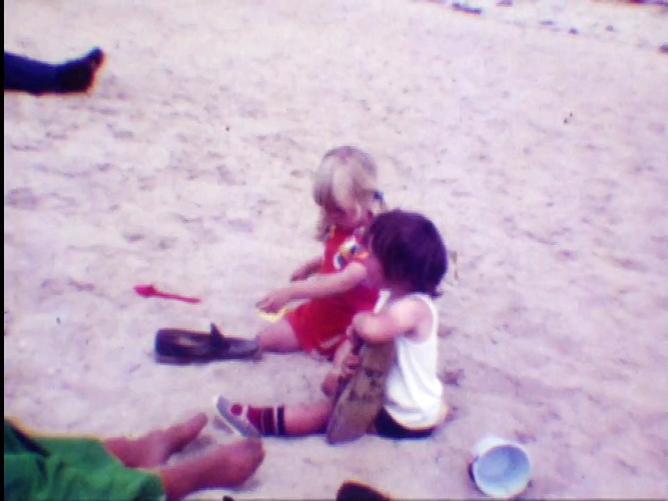 cine film: young children playing on a beach in 1974, no sound
