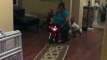 **WOMAN RIDING CHILDS TOY** with child trying to pushing it!