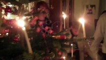 Danish Christmas tradition dancing around the Christmas tree with real candles