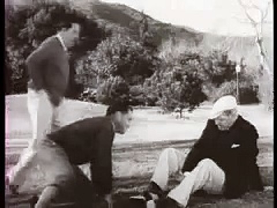 Bobby Jones consoles W.C. Fields on his poor golf swing