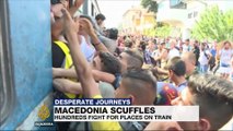 Desperate migrants in Macedonia fight for place on train