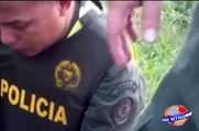 Colombian officer disarms man with grenade