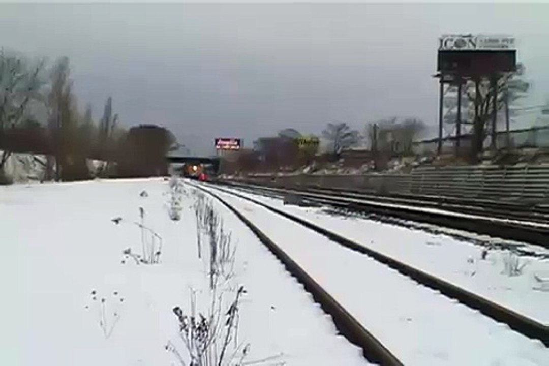 Via Rail train moving fast in snow