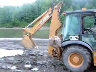 Trucks stuck in mud hole