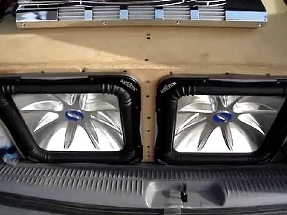Two 15" Kicker solo baric L7 subs in a sealed box & 2400 watt Audiobahn A2300HCT wired to 1 ohm
