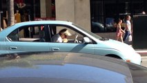Guy plays flute in his car while driving like a boss!