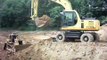 Komatsu excavator and Caterpillar dozer dozer and MAN dump truck at work