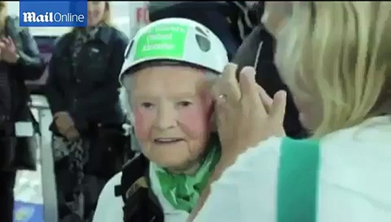 101-year-old woman breaks her own world record as the oldest abseiler by roping down one of Britain's tallest buildings