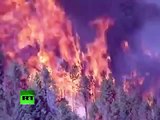 Los bomberos comienzan a contener los grandes incendios forestales en EE. UU.