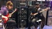 Etienne Mbappé with his son Swaeli at the EBS NAMM 2013 booth with a Mayones Jabba Classic 5
