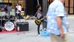 Black kid playing heavy metal music on guitar in New York