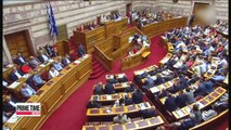 Greek parliament approves harsh austerity bill needed to secure bailout