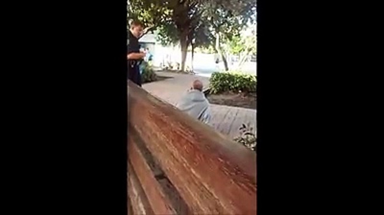 Cop slapping the shit out of an old man.