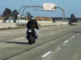Crazy dancing motorcycle guy on the freeway