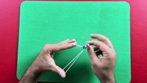 anello fuori dall'elastico loop a rubber band, magic tricks revealed