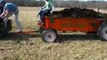 steam tractor pulling manure spreader