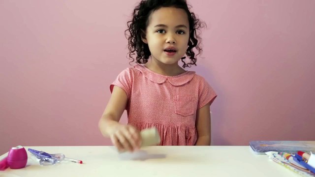 Girl does great tricks with home objects: toothbrush, CD...
