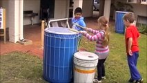 Children exploring playground equipment as musical instruments - Child's Play Music