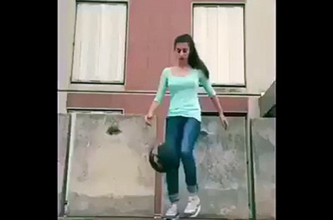 Football dribble by a girl