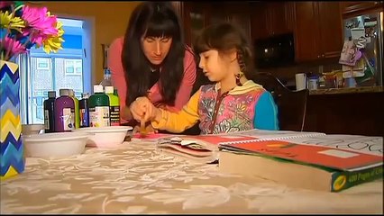 Service Dog Keeping An Eye On Young Girl With Epilepsy