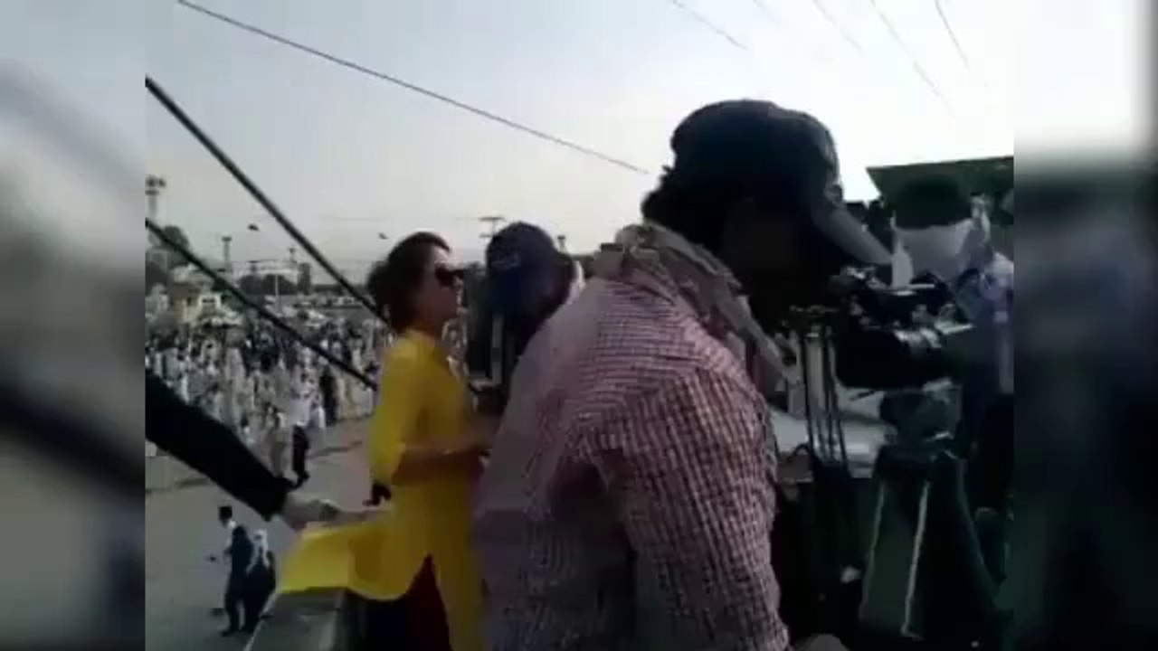 Female Anchor (Ghareeda Farooqi) Climbing on Poll