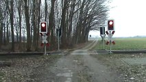 German Railroad Crossing action at Breyel,Germany and ore train DB schenker