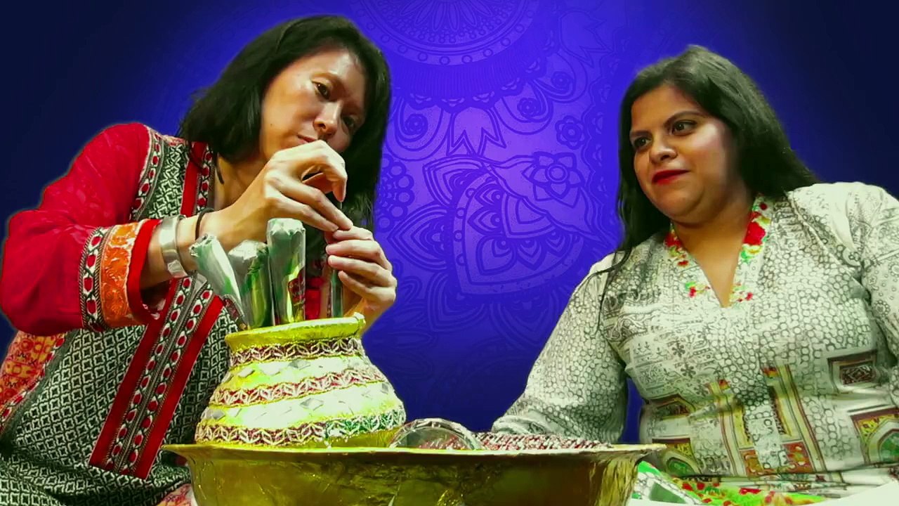 US Consulate staffers try their hand at applying mehndi