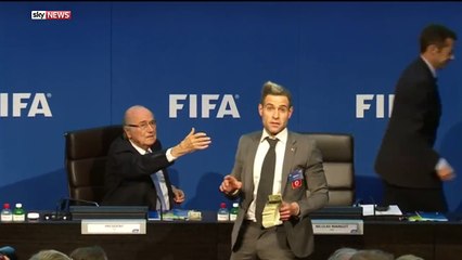Lee Nelson showered FIFA president Sepp Blatter with dollar bills