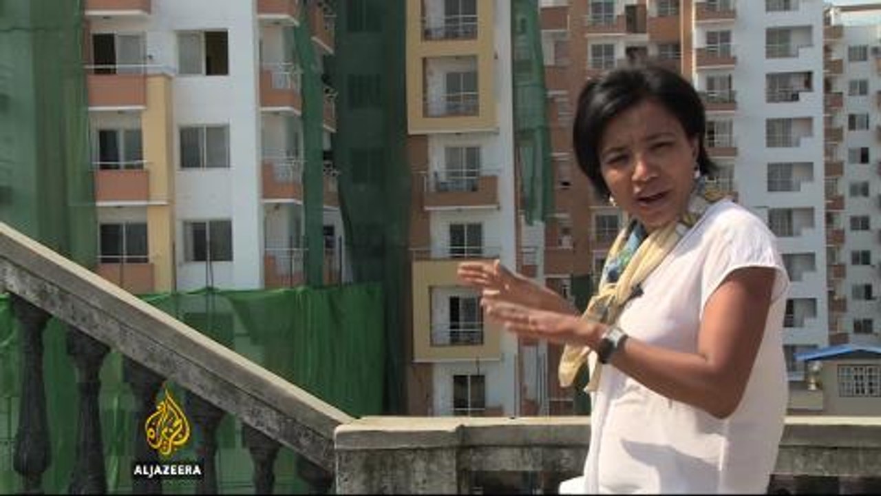 Quake-damaged buildings loom over Nepal's communities