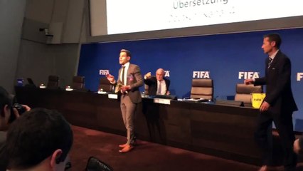 Protester Throws Money at Blatter