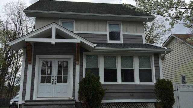 Crane Foam Backed Vinyl Siding NJ Bergen County-License contractor home remodeling specialist-Beautiful completed exteterior installation company-Insulated board and Batten panels custom bent aluminum casing trimming accessories-Front portico entry
