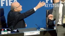 Comedian Simon Brodkin throws money at FIFAs Sepp Blatter