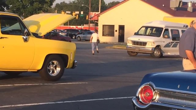 Lady randomly dances by herself in parking lot