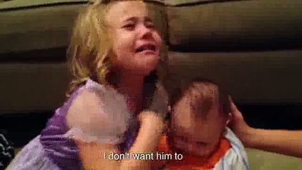 Girl crying because baby is too cute