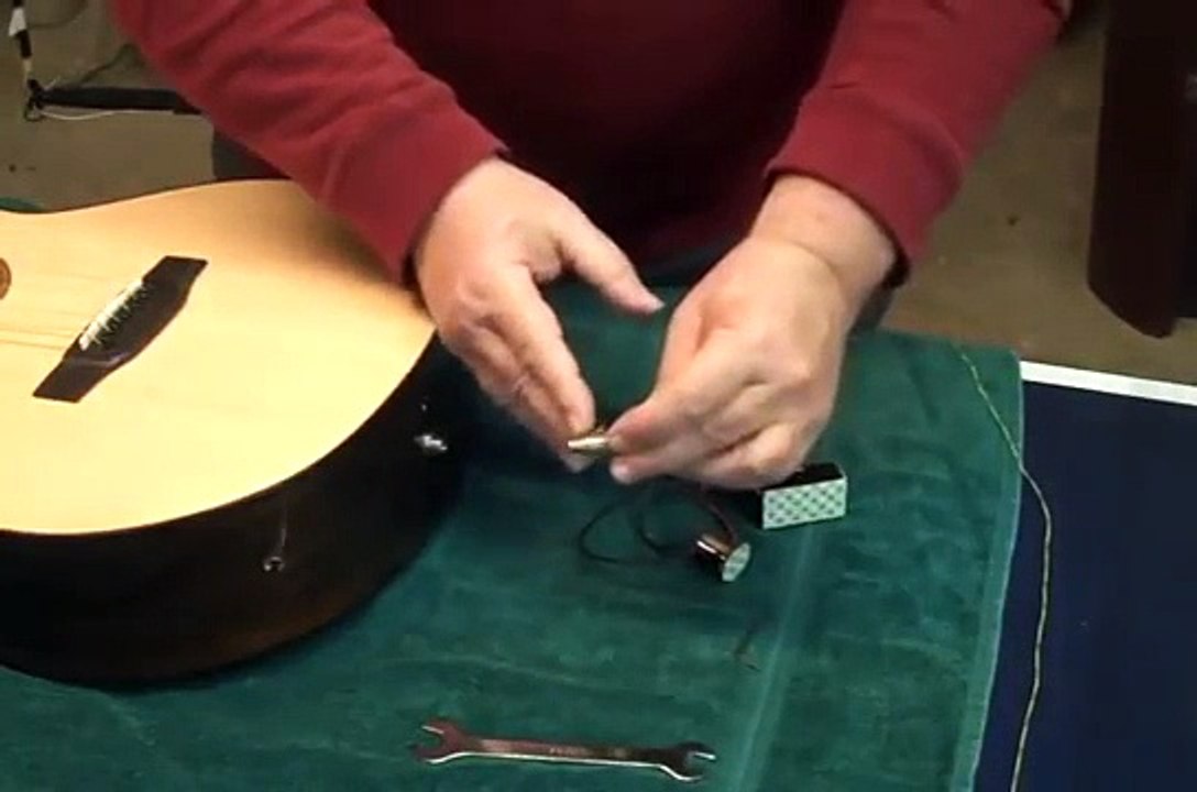 Installing an end pin jack in an acoustic guitar