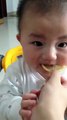 Cute Baby tasting lemon first time...