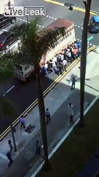 Mob saves a man crushed under a huge lorry